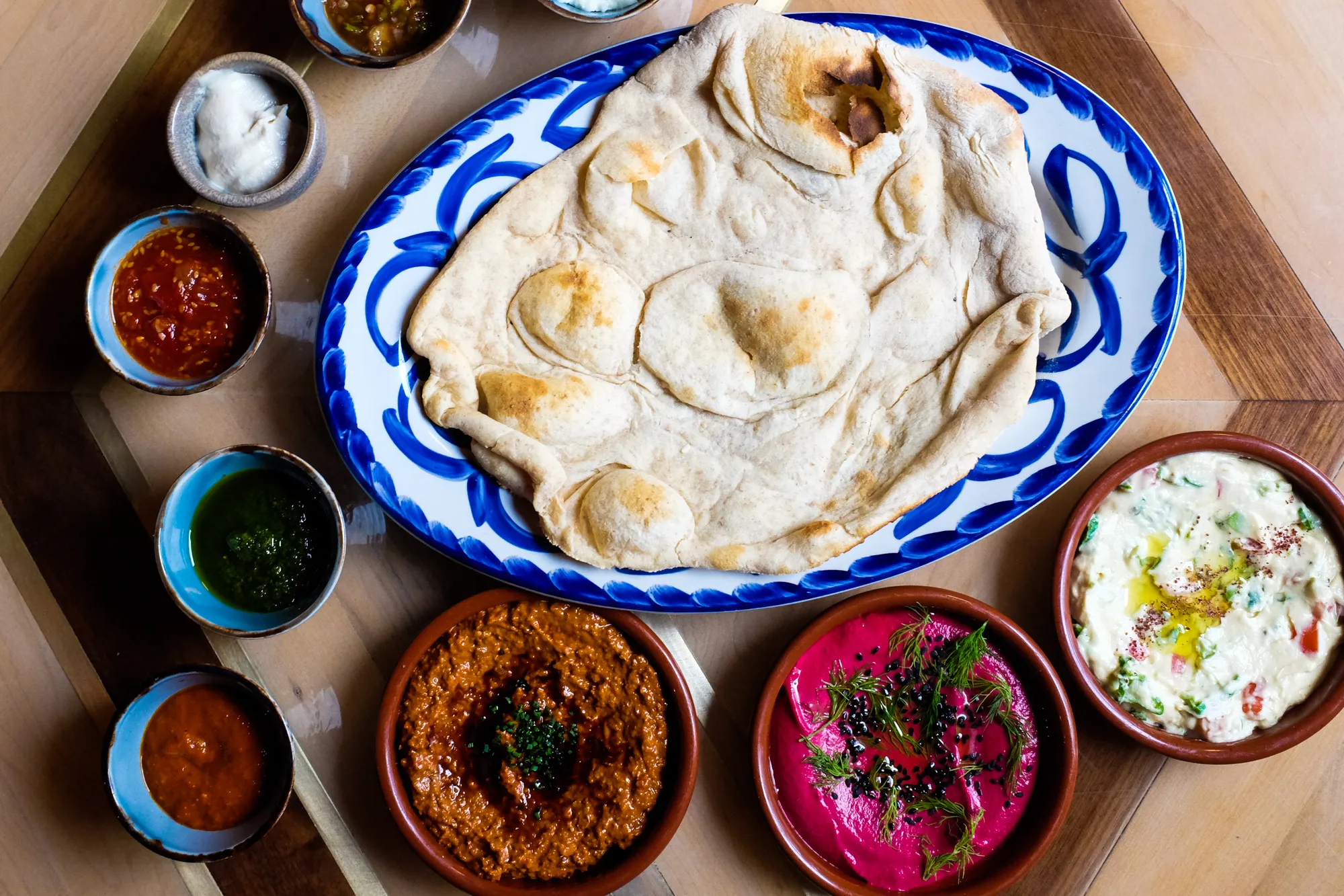 Maydan signature dishes Mezze Dips and Pita Bread
Branzino
Whole Chicken